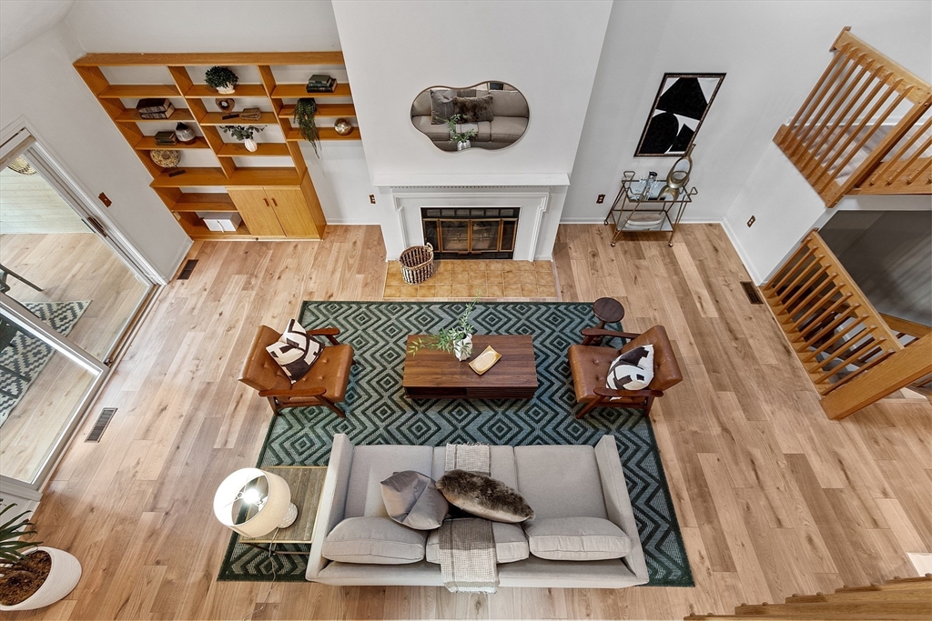 28 Monadnock Drive, Unit 28 Westford, MA 01886 - Photo 23 of 31 a living room with furniture and a fireplace