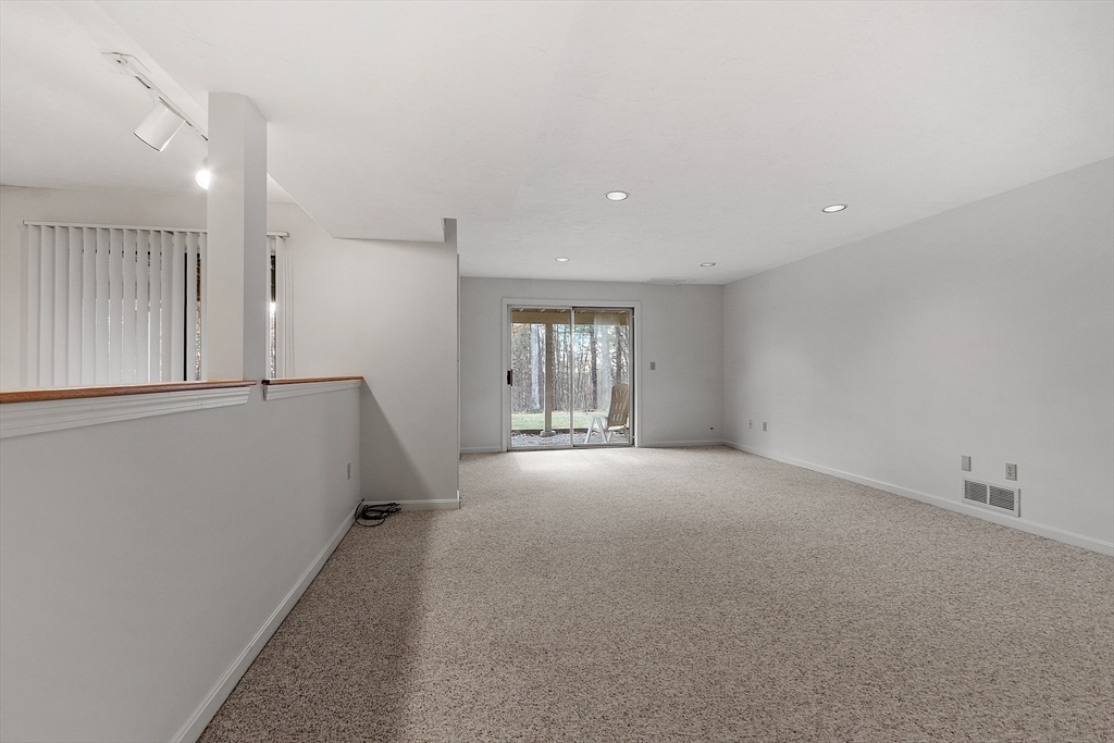28 Monadnock Drive, Unit 28 Westford, MA 01886 - Photo 25 of 31 a view of empty room with windows