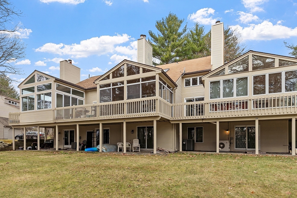 28 Monadnock Drive, Unit 28 Westford, MA 01886 - Photo 27 of 31 a front view of a building with a garden