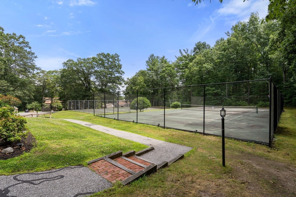 28 Monadnock Drive, Unit 28 Westford, MA 01886 - Photo 31 of 31 a view of a backyard with entertaining space