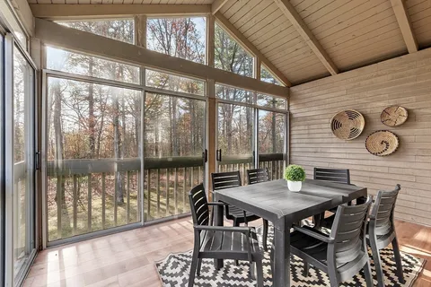 a view of a dining room with furniture window and outside view