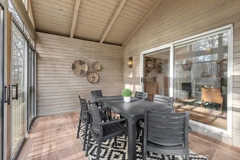 a dining room with furniture and window