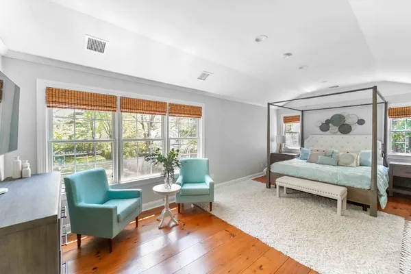 a bed room with a bed and a window