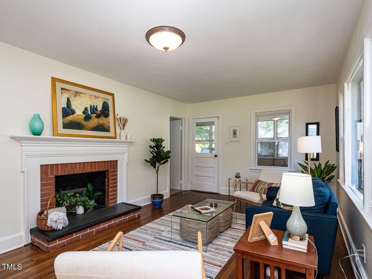 1112 Horton Road Durham, NC 27704 - Photo 3 of 30 a living room with furniture and a fireplace