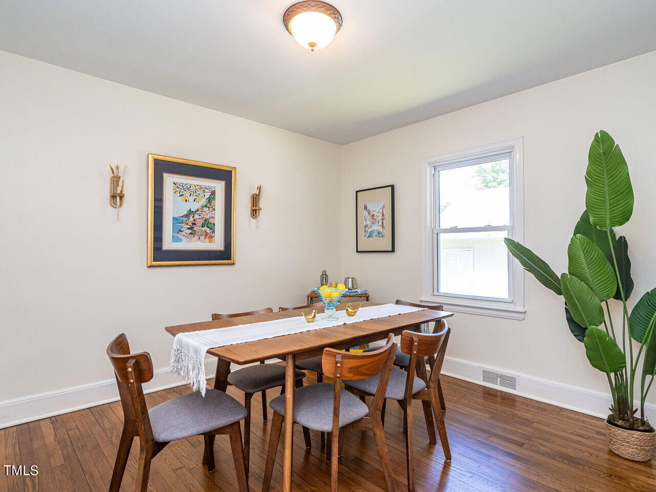 1112 Horton Road Durham, NC 27704 - Photo 9 of 30 a view of a dining room with furniture and wooden floor