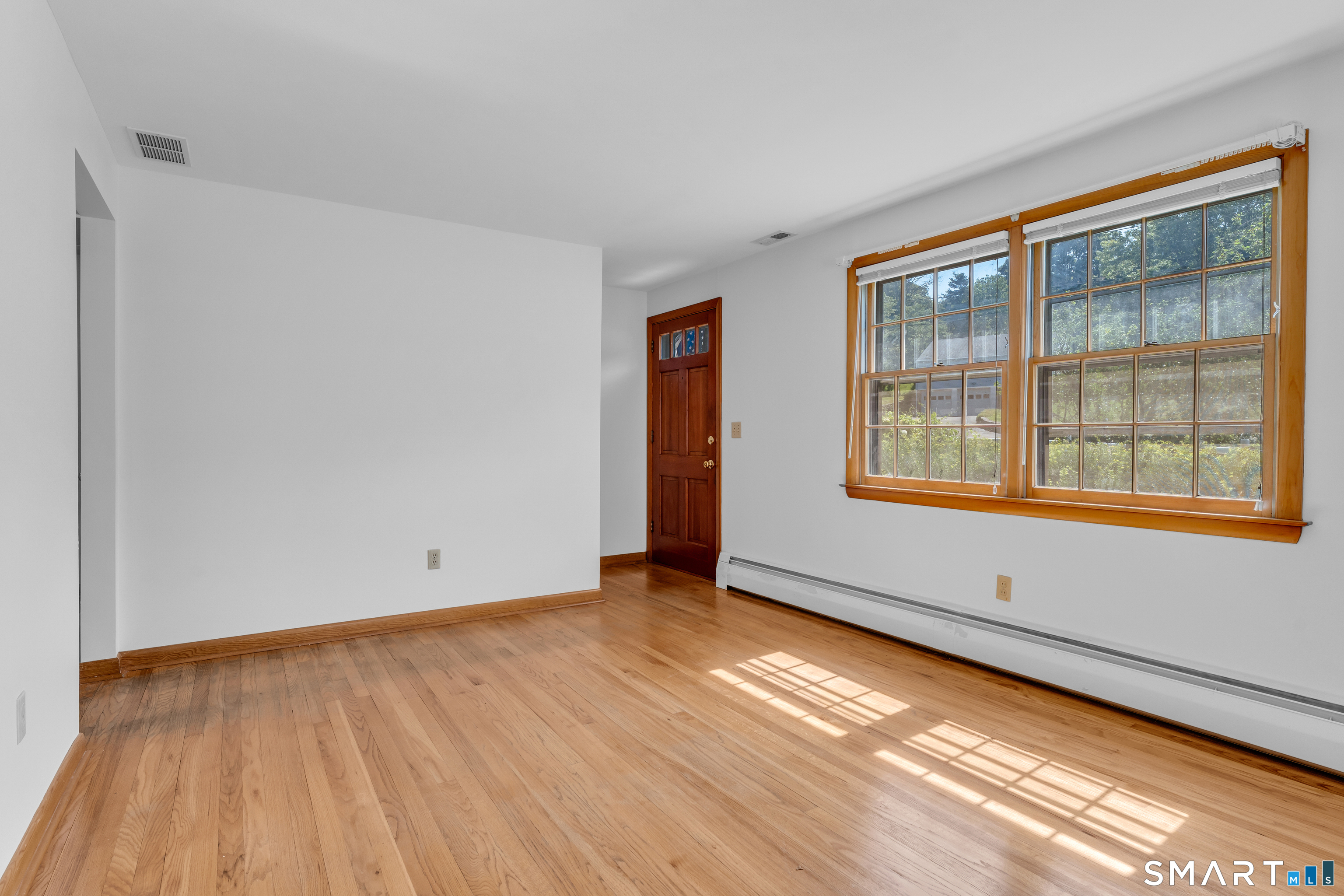 25 Goose Hill Road Chester, CT 06412 - Photo 2 of 24 Living Room with hardwood flooring awaits your upgrades.