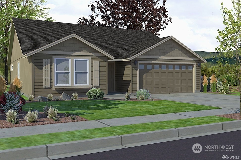 1924 Oak Road Moses Lake, WA 98837 - Photo 1 of 1 a front view of a house with a yard