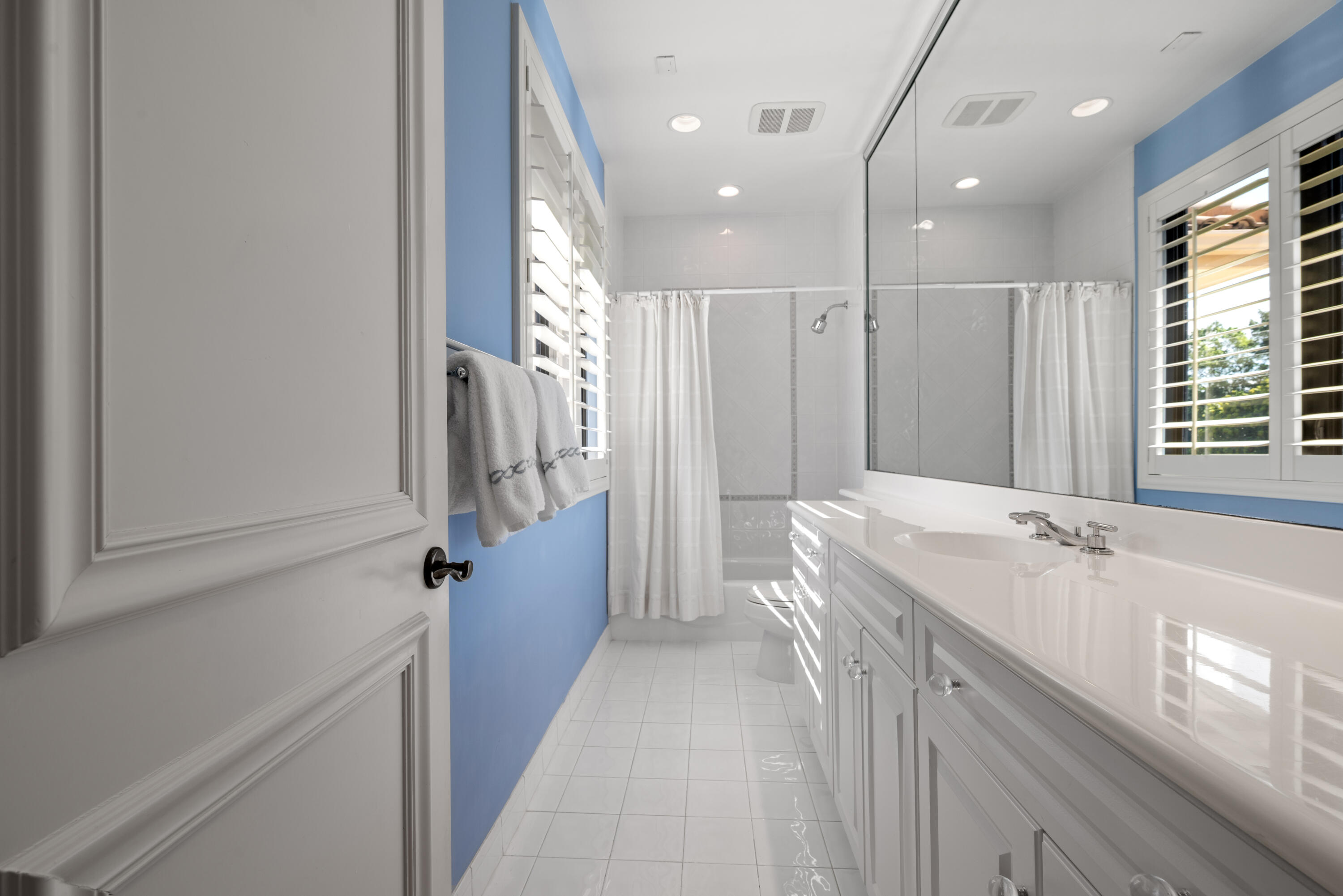 18800 Long Lake Drive Boca Raton, FL 33496 - Photo 39 of 60 a bathroom with a granite countertop sink a toilet a tub and shower