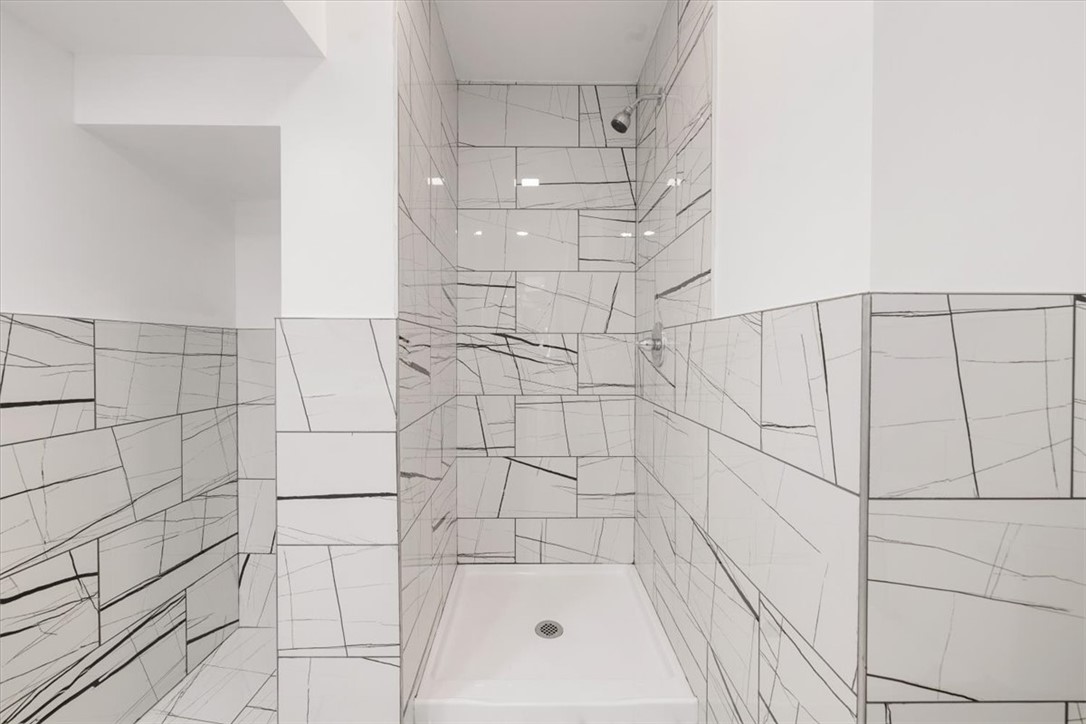 629 Little Meadow Drive Riverside, OH 45404 - Photo 23 of 48 This newly renovated bathroom features a spacious shower with sleek tile, providing a fresh and inviting space.