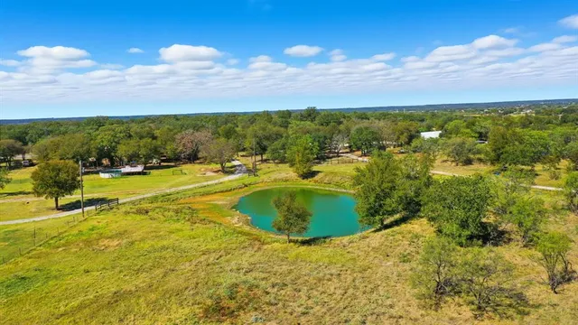 a view of a swimming pool with an outdoor seating and kitchen