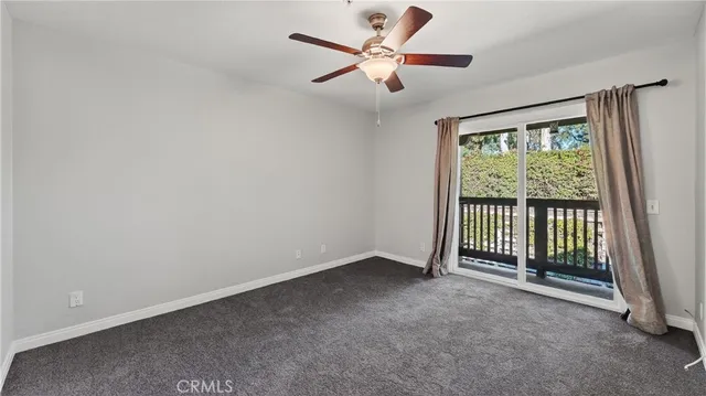 an empty room with a fan