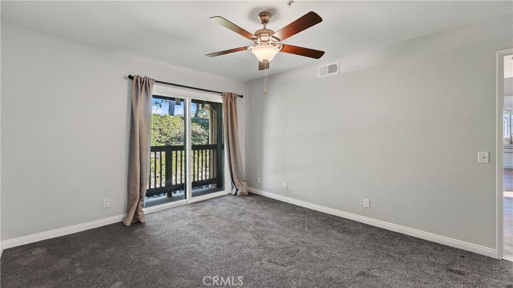 103 South Cross Creek Road, Unit B Orange, CA 92869 - Photo 17 of 29 an empty room with fan and windows