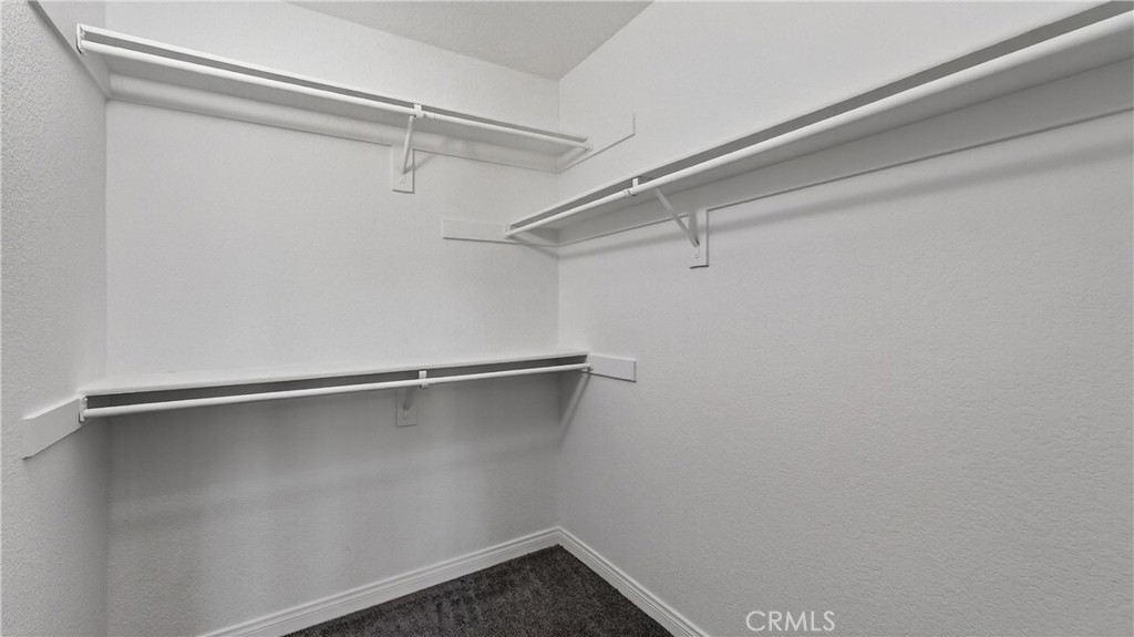 103 South Cross Creek Road, Unit B Orange, CA 92869 - Photo 18 of 29 a view of a room with racks on the wall