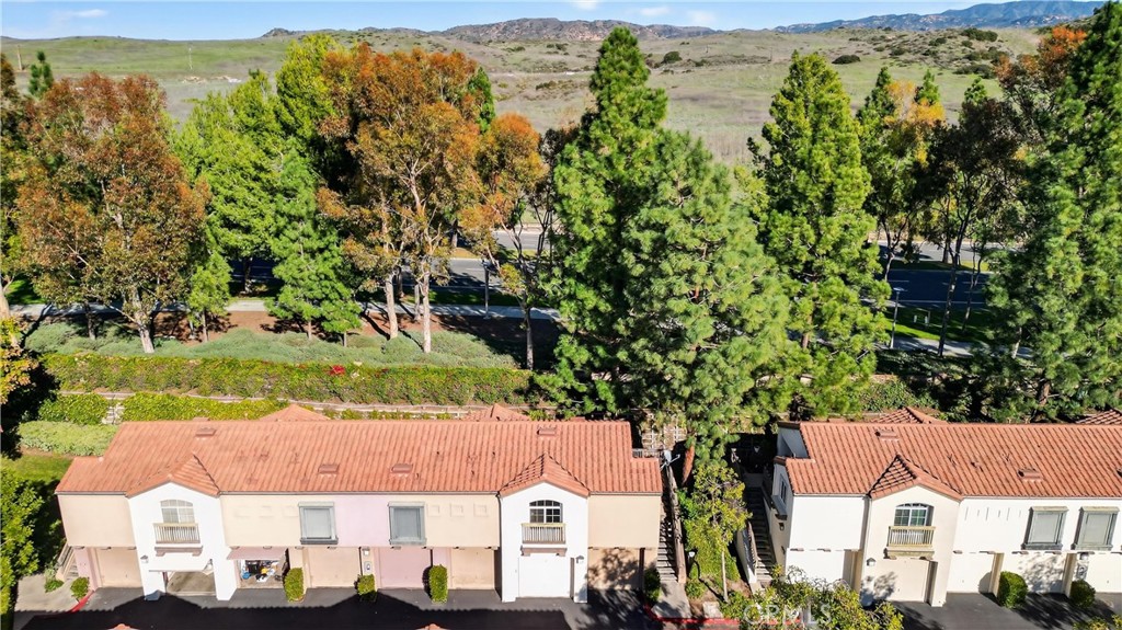 103 South Cross Creek Road, Unit B Orange, CA 92869 - Photo 27 of 29 an aerial view of residential houses with outdoor space and trees