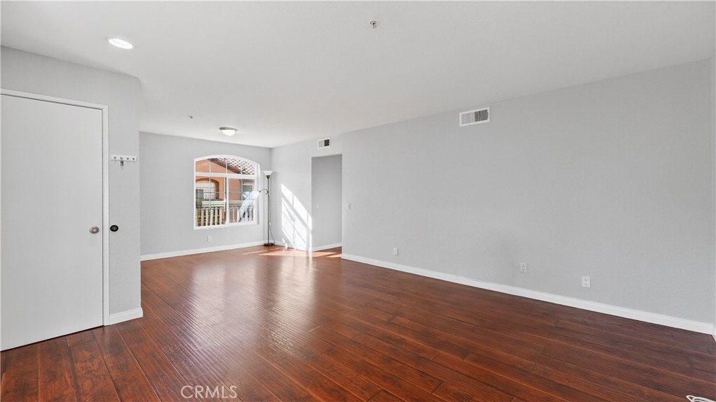 103 South Cross Creek Road, Unit B Orange, CA 92869 - Photo 4 of 29 a view of empty room with wooden floor and fan