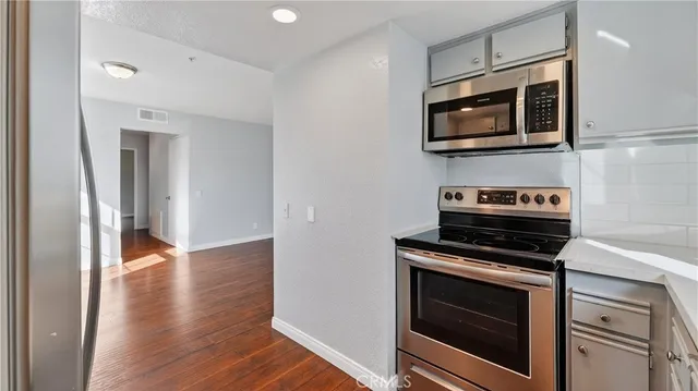 a kitchen with a stove and a microwave