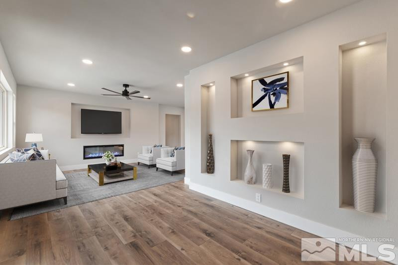995 Skyline Boulevard Reno, NV 89509 - Photo 7 of 34 a living room with furniture and a flat screen tv