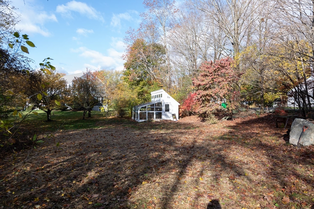 3 October Lane Weston, MA 02493 - Photo 14 of 32 a house with trees in front of it