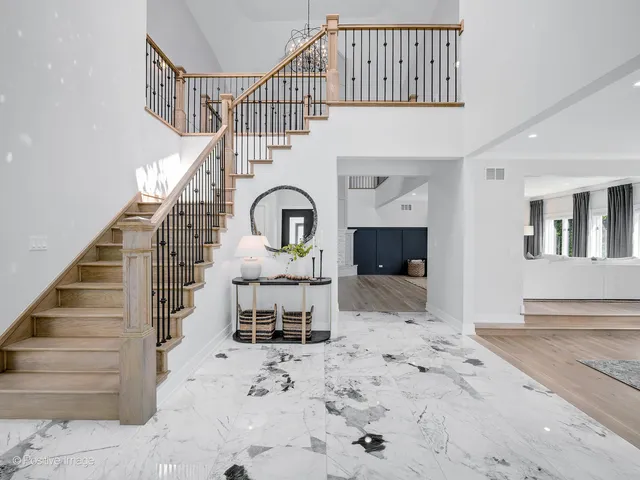 a dining room with furniture window and wooden floor