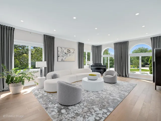 a large kitchen with stainless steel appliances kitchen island granite countertop a stove a sink and a refrigerator