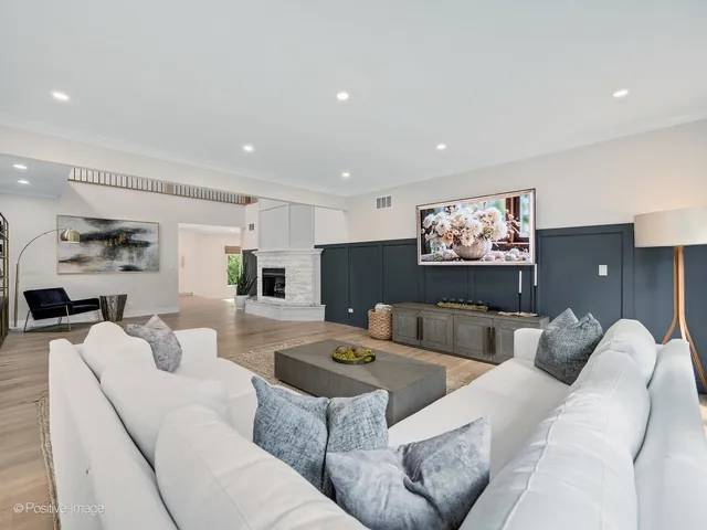 a kitchen with stainless steel appliances kitchen island granite countertop a sink a stove and a refrigerator