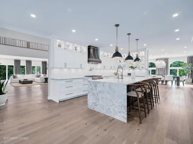 a spacious bathroom with a double vanity sink double mirror and bathtub