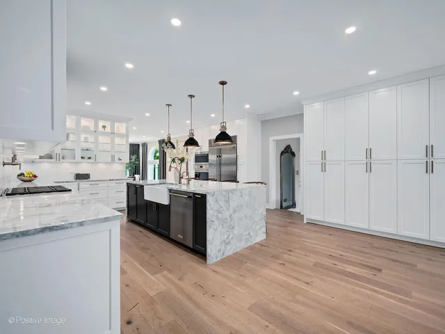 a spacious bedroom with a bed and a window