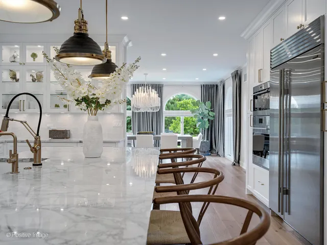 a view of a kitchen with a sink washer and dryer