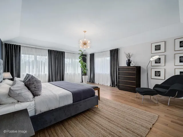 a view of a house with a flat tv screen and a garden