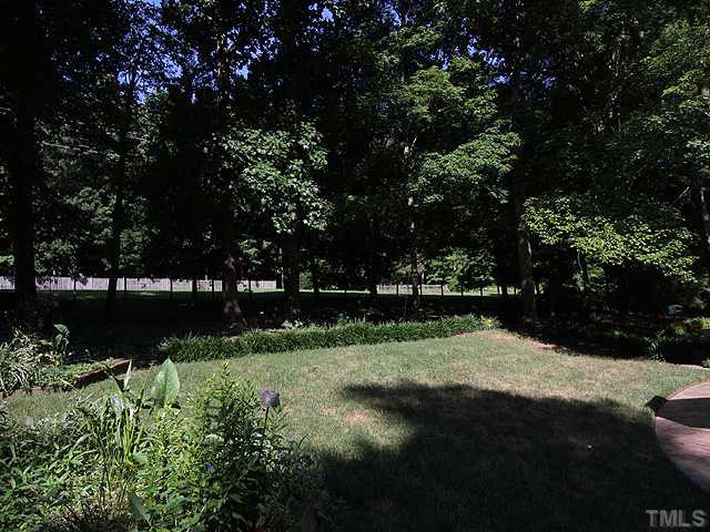 8829 Woodyhill Road Raleigh, NC 27613 - Photo 12 of 21 This backyard is private and large.