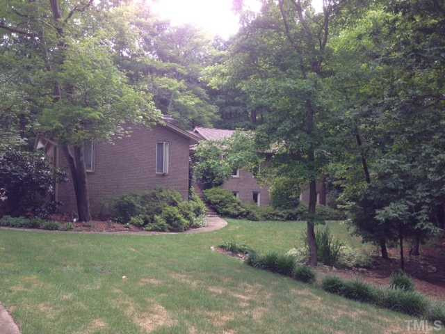 8829 Woodyhill Road Raleigh, NC 27613 - Photo 16 of 21 This lot has lots of nice hardwoods.