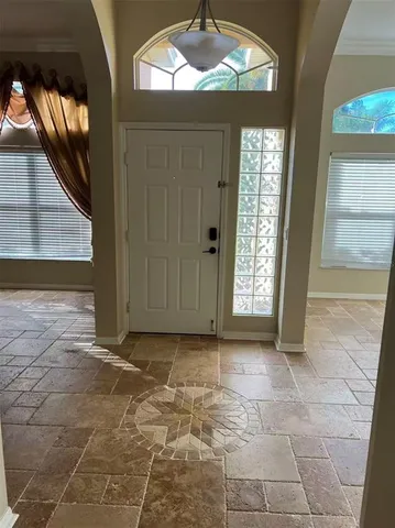 a view of entryway with a front door