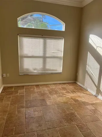 a living room with a fireplace and a flat screen tv