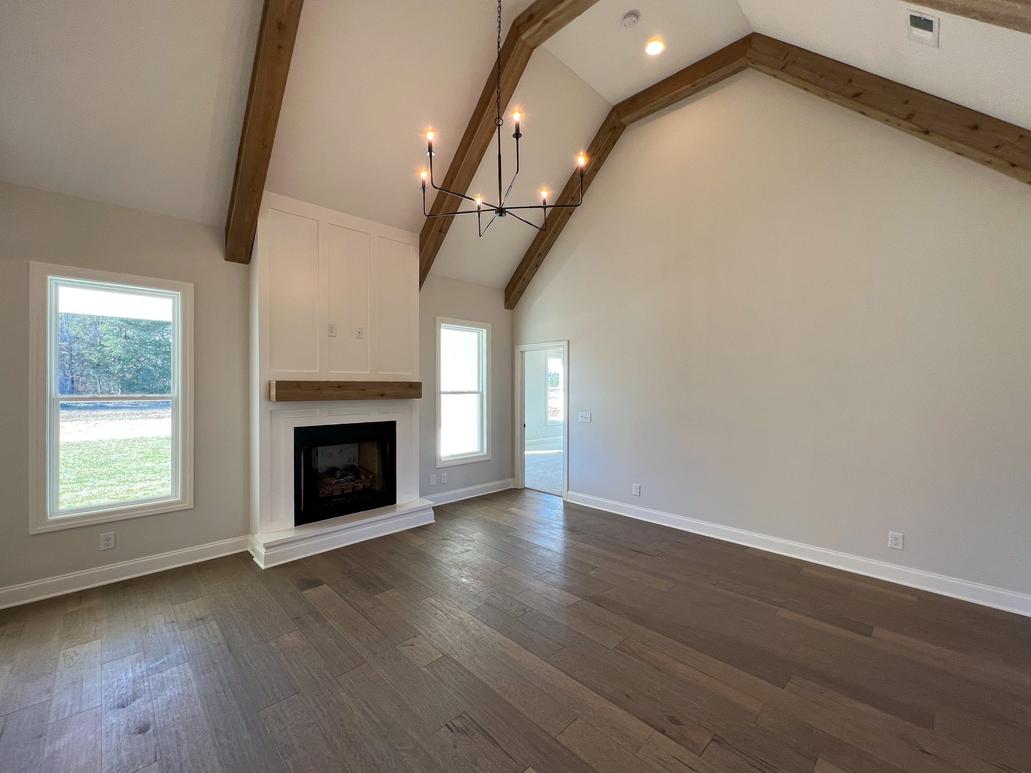 4520 McCrary Road Lebanon, TN 37090 - Photo 6 of 20 an empty room with wooden floor fan and windows