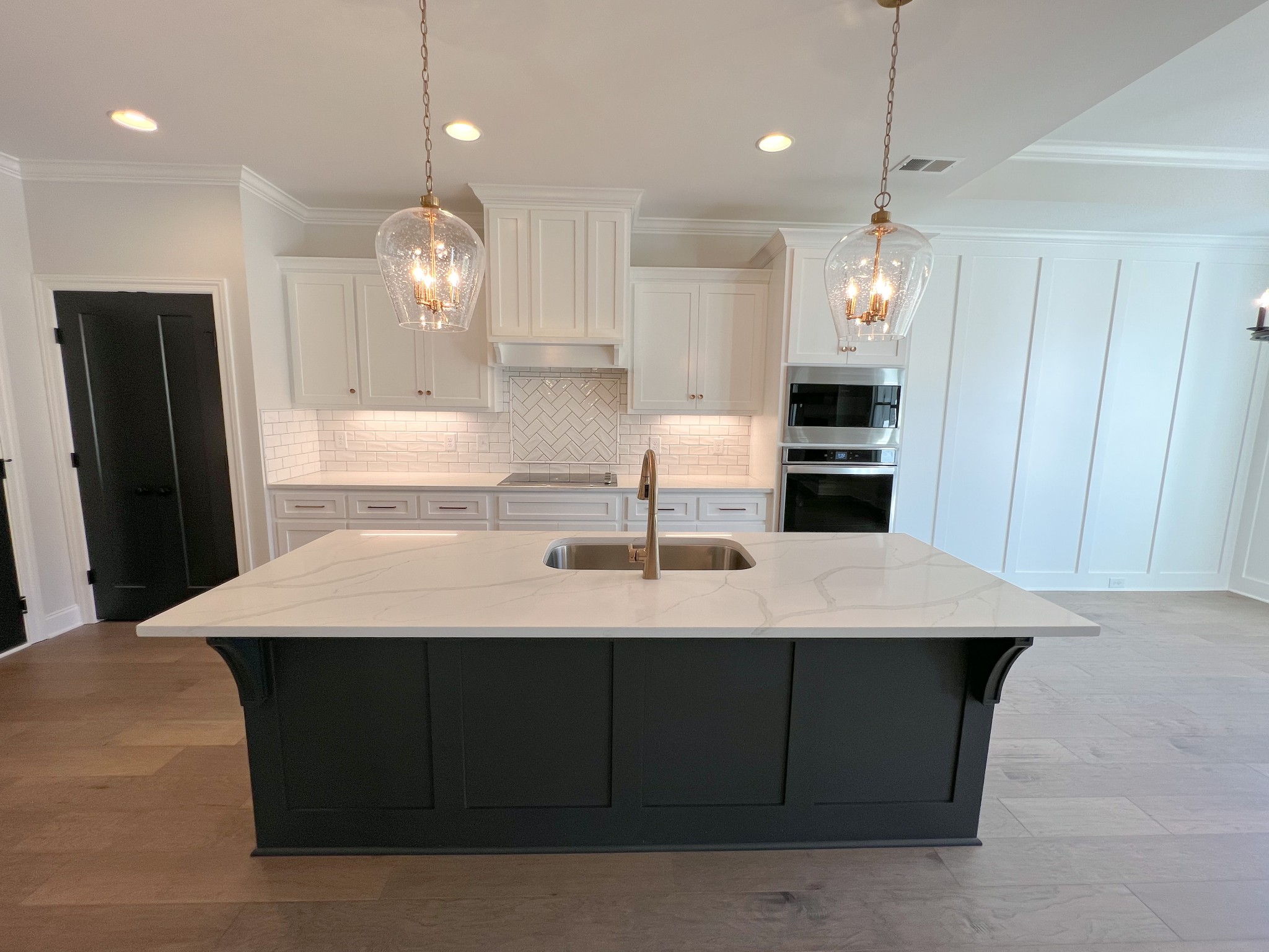4520 McCrary Road Lebanon, TN 37090 - Photo 7 of 20 a kitchen with kitchen island stainless steel appliances sink cabinets and wooden floor