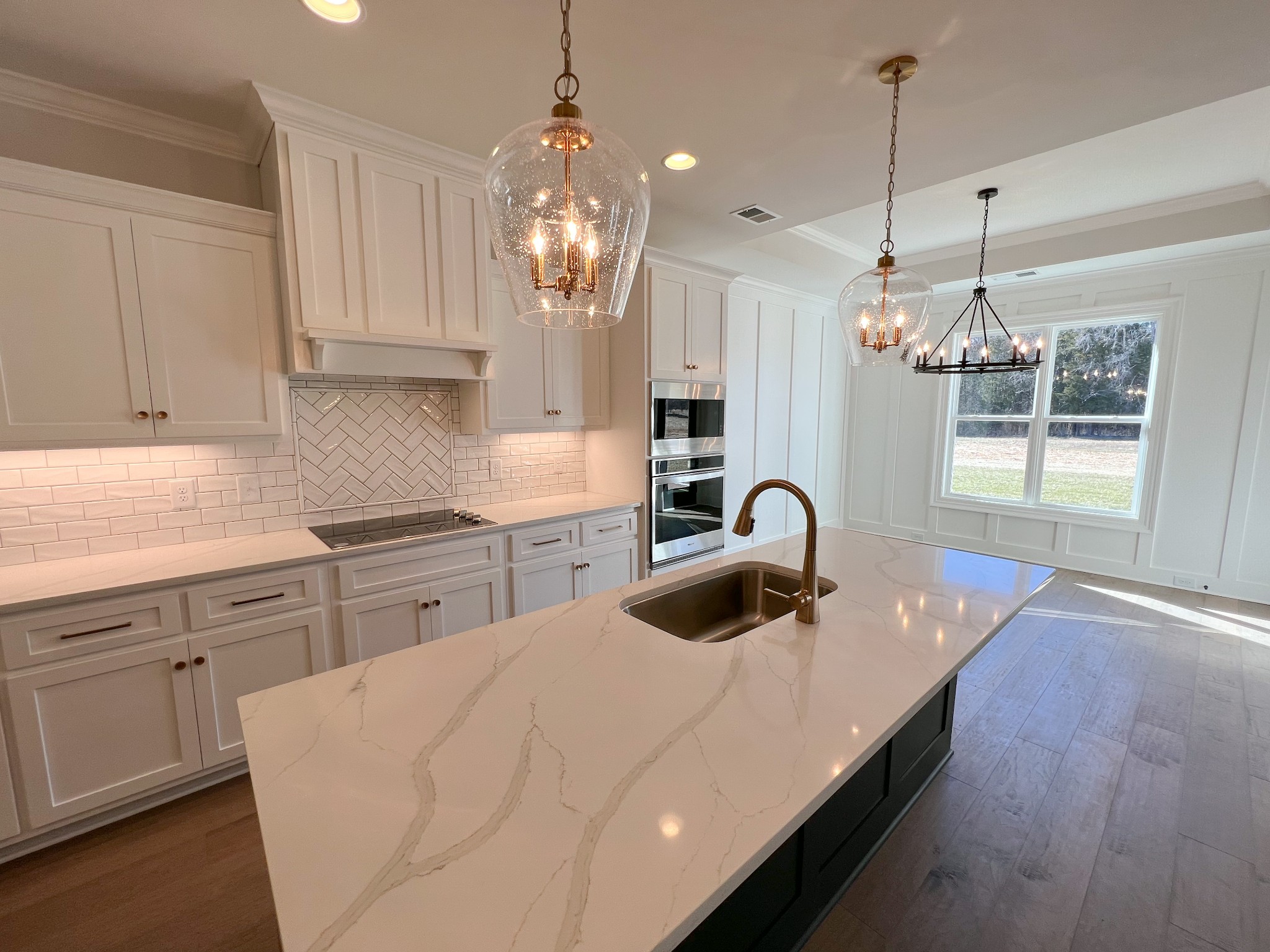 4520 McCrary Road Lebanon, TN 37090 - Photo 8 of 20 a kitchen with kitchen island granite countertop a sink a counter space appliances and cabinets