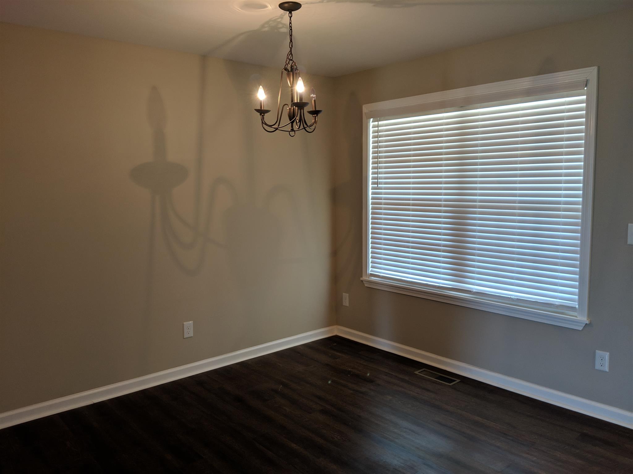 147 A T G T Road Portland, TN 37148 - Photo 4 of 11 an empty room with wooden floor and windows