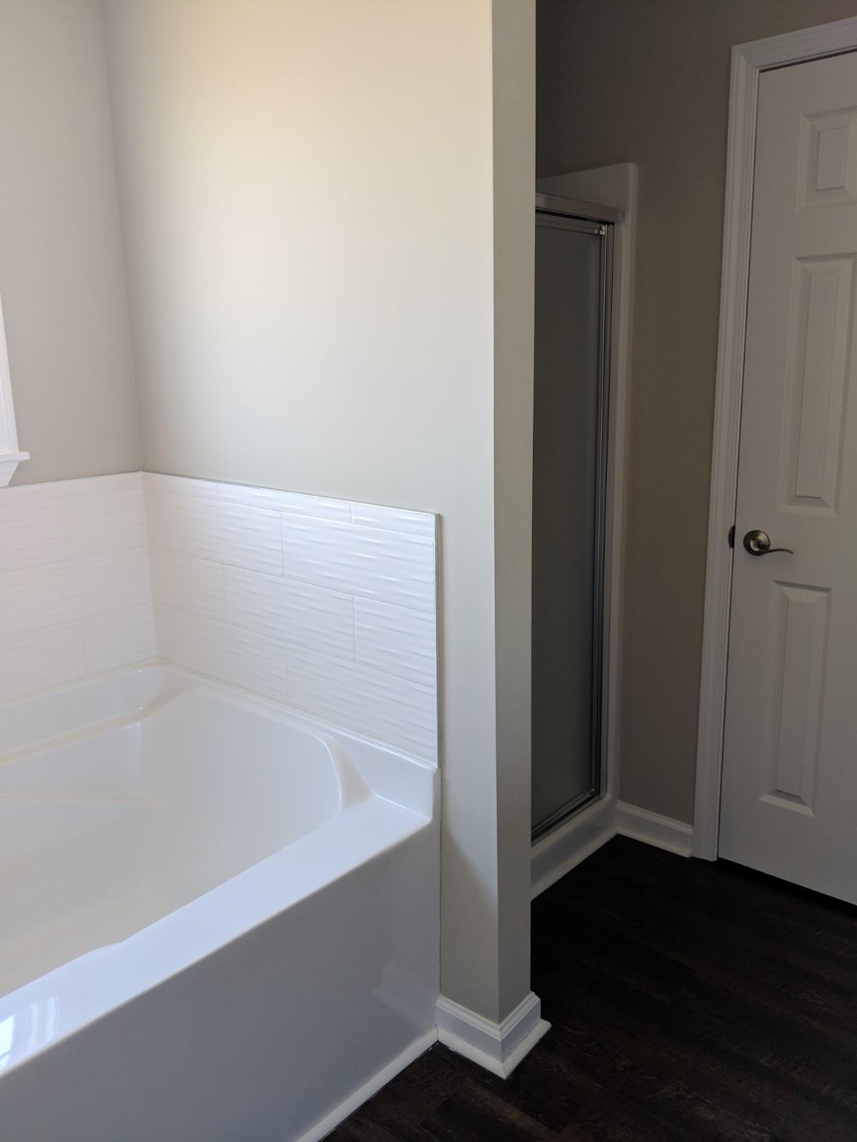 147 A T G T Road Portland, TN 37148 - Photo 8 of 11 a white bath tub sitting in a bathroom