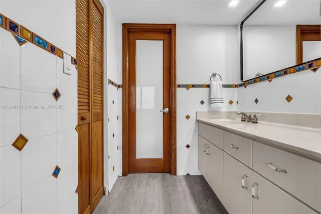 a bathroom with a toilet sink and shower