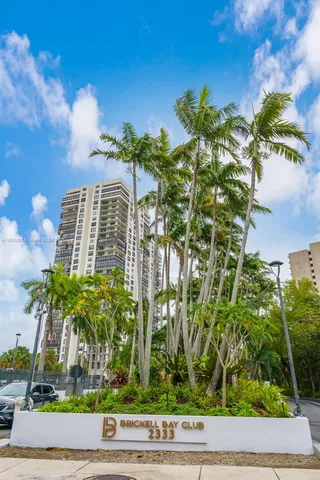 a view of a swimming pool with a patio and a garden