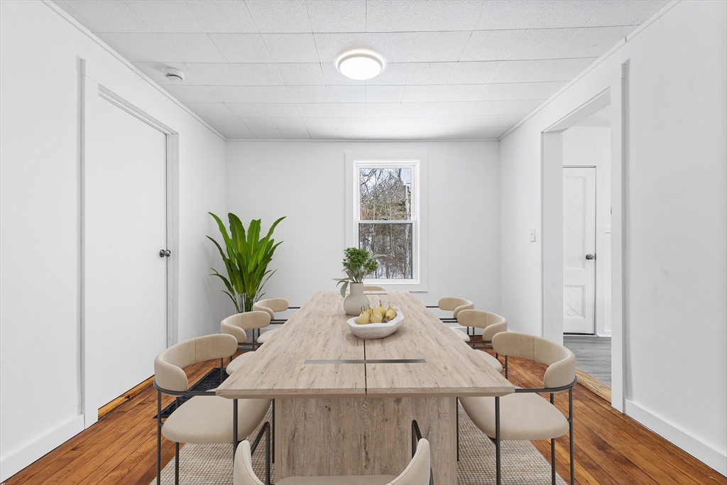 597 Mendon Road Northbridge, MA 01534 - Photo 5 of 13 a view of a dining room with furniture and wooden floor