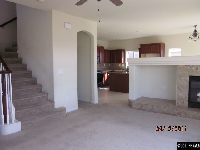 1436 Hagar Road Reno, NV 89506 - Photo 2 of 10 a view of a kitchen and an empty room with a fireplace