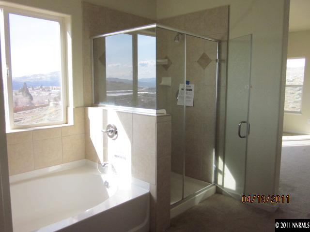1436 Hagar Road Reno, NV 89506 - Photo 7 of 10 a bathroom with a bathtub and a shower