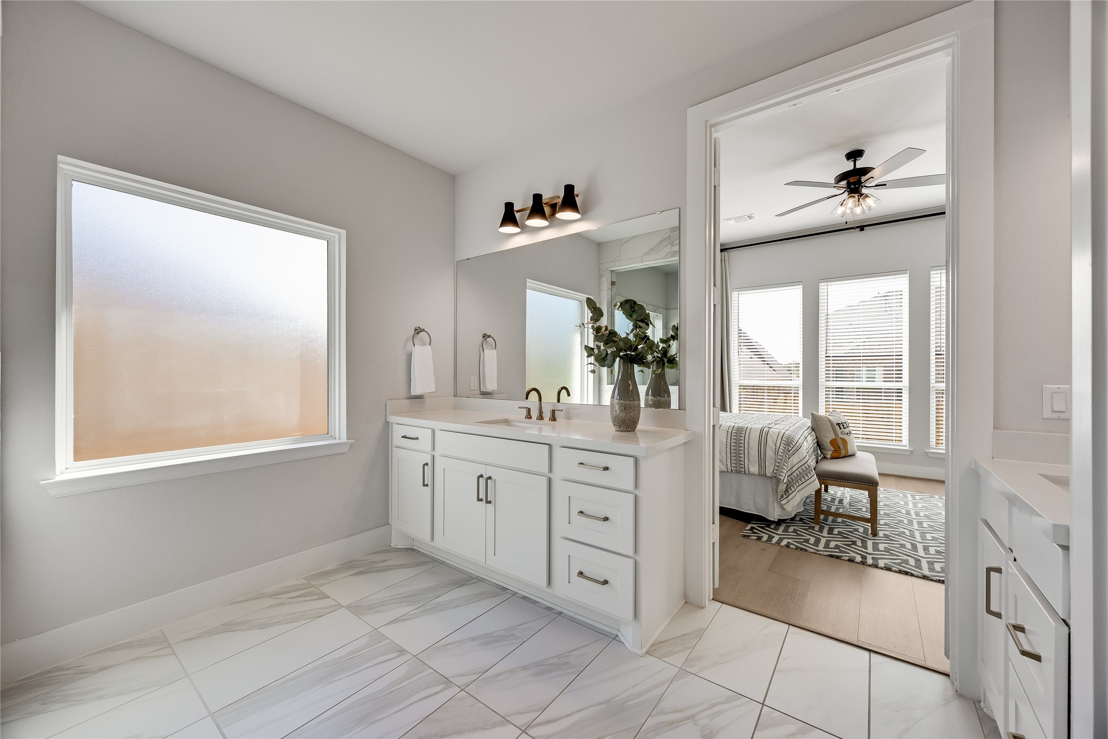 200 Grn Knl Lane Georgetown, TX 78628 - Photo 17 of 32 a spacious en suite bathroom with a double vanity sink and a window