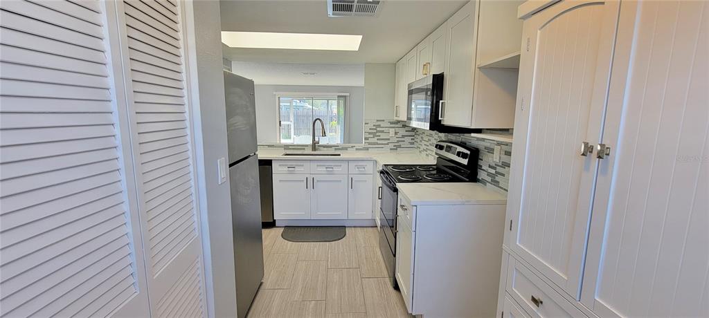 3342 Teeside Drive New Port Richey, FL 34655 - Photo 11 of 45 a en suite bathroom with a sink and a mirror