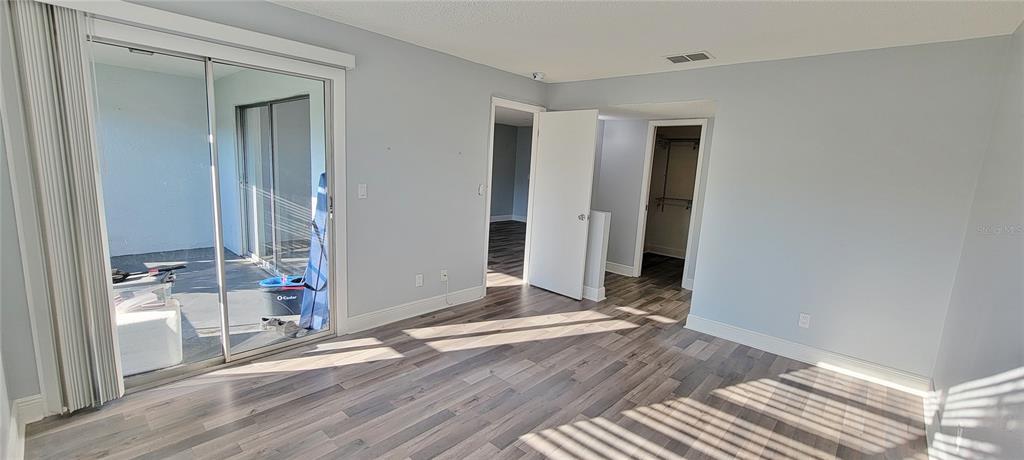 3342 Teeside Drive New Port Richey, FL 34655 - Photo 22 of 45 a view of an empty room with wooden floor and a window
