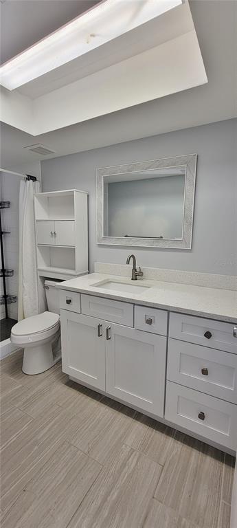 3342 Teeside Drive New Port Richey, FL 34655 - Photo 28 of 45 a bathroom with a double vanity sink a toilet and a shower