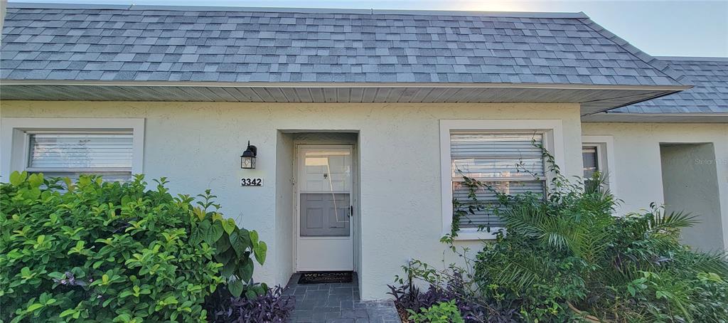 3342 Teeside Drive New Port Richey, FL 34655 - Photo 3 of 45 a view of a stone house with plants