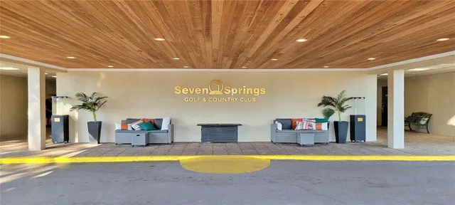 a swimming pool with a table and chairs