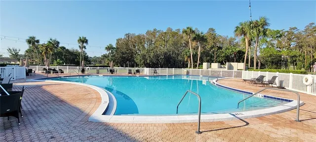 a view of a swimming pool with a patio
